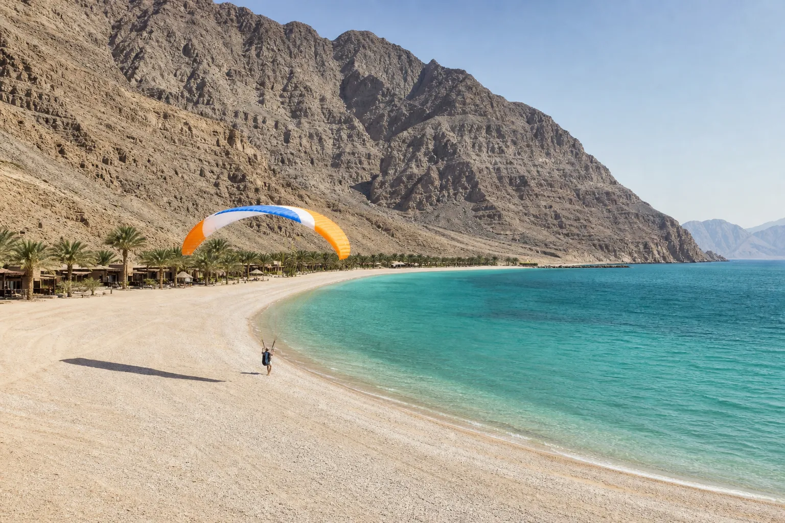 Zighy Bay: The Crescent Beach Between the Cliffs